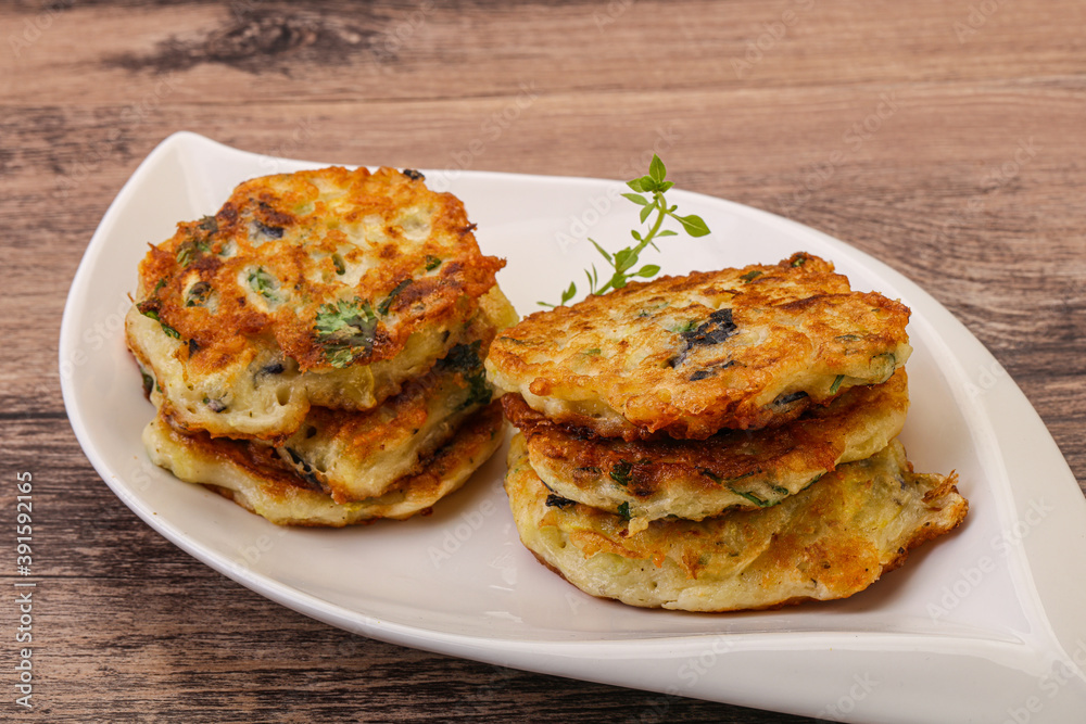 Zucchini pancakes with herbs and spices Zucchini pancakes with herbs and spices