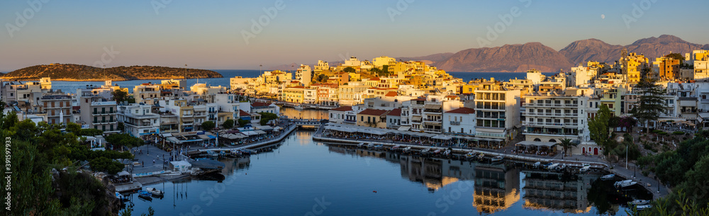 Beautiful late even sunlight illuminating buildings in the centre of the Cretan town of Agios Nikolaos