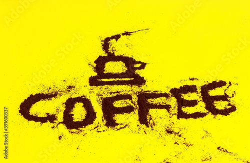 coffee powder / A cup of coffee and the word coffee  drawn using the coffee powder