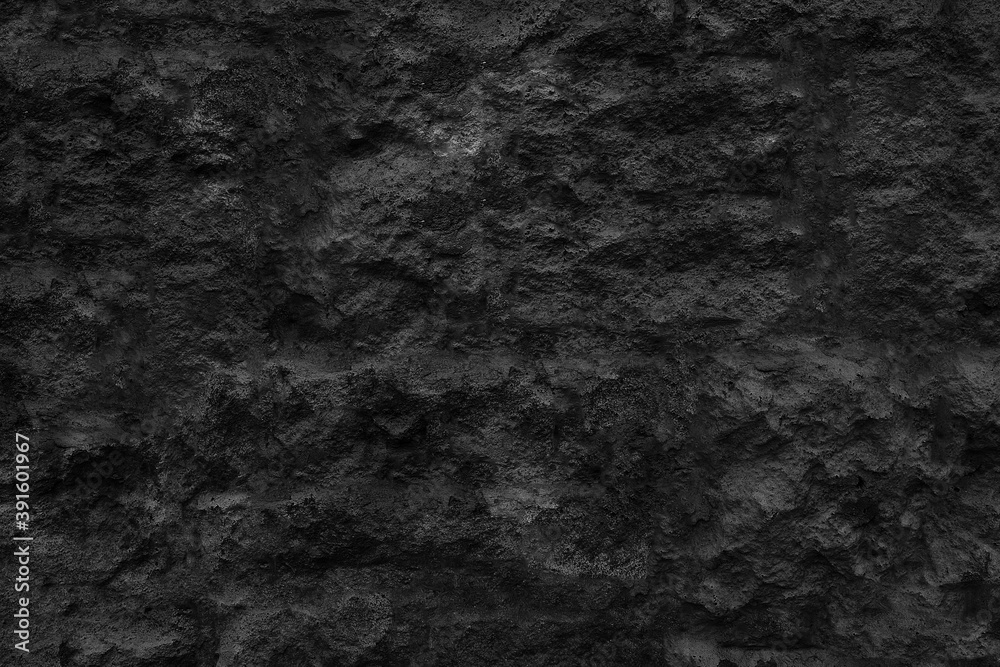Surface of the cave rock wall. Dark gray stone texture background. Surface of the cave rock wall. Dark gray stone texture background.