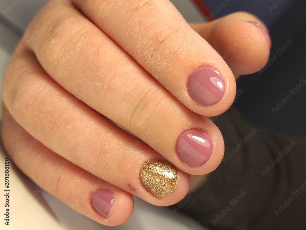 beautiful manicure of nails on the background of a fashionable beautiful manicure of nails on the background of a fashionable