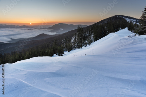 Winter in the Ukrainian Carpathian mountains with morning fogs