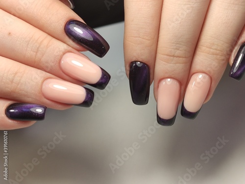 glamorous beautiful manicure on a trendy texture