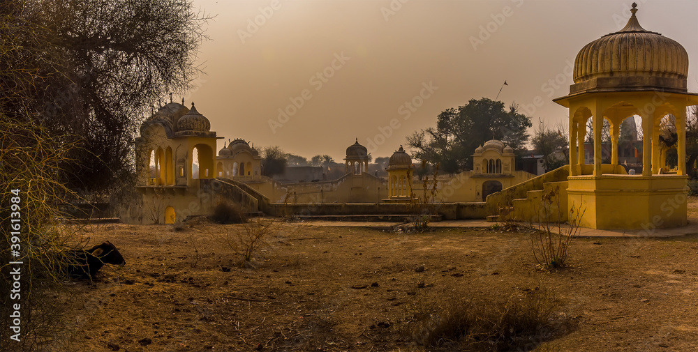 A view of an old water harvesting well on the outskirts of Mandawa, India in the early morning glow at sunrise