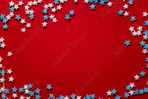 red christmas background with white and blue stars
