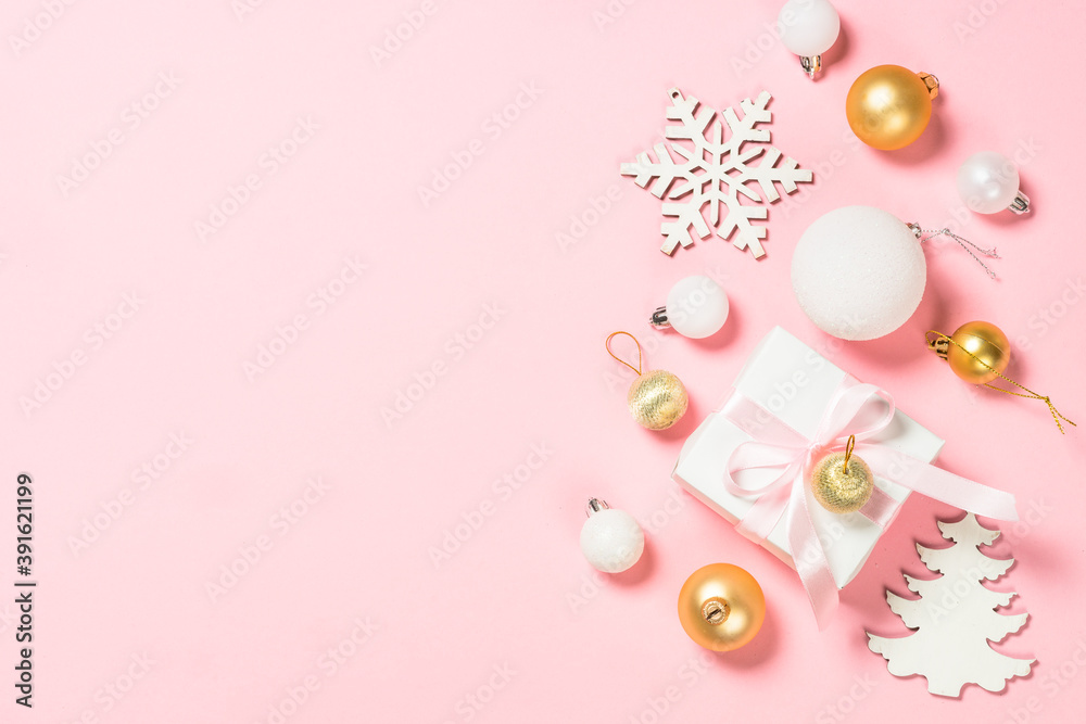 Christmas pink flat lay background with holiday decorations.