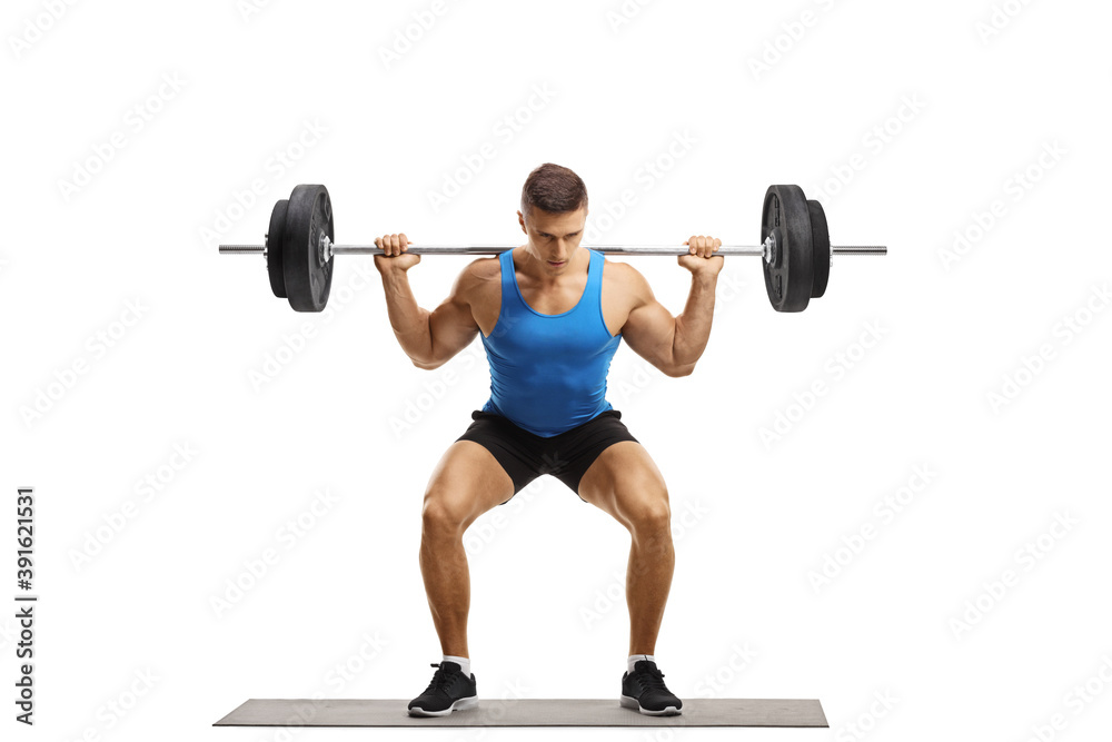 Strong young man training with weights Strong young man training with weights
