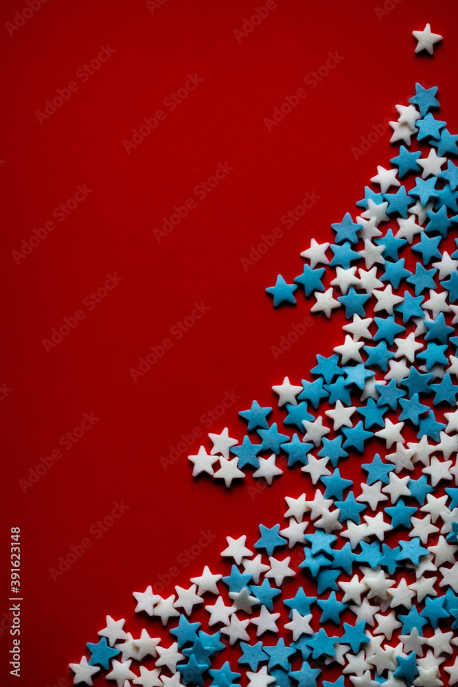 christmas tree made of stars on a red background