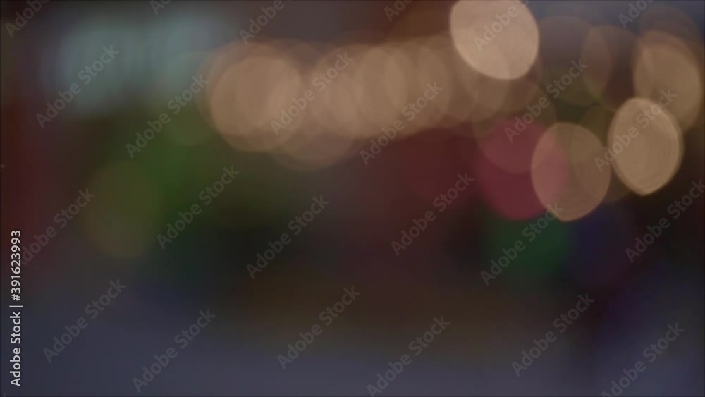 Footage of city night with abstract colorful bokeh. Footage of night city street lights bokeh background