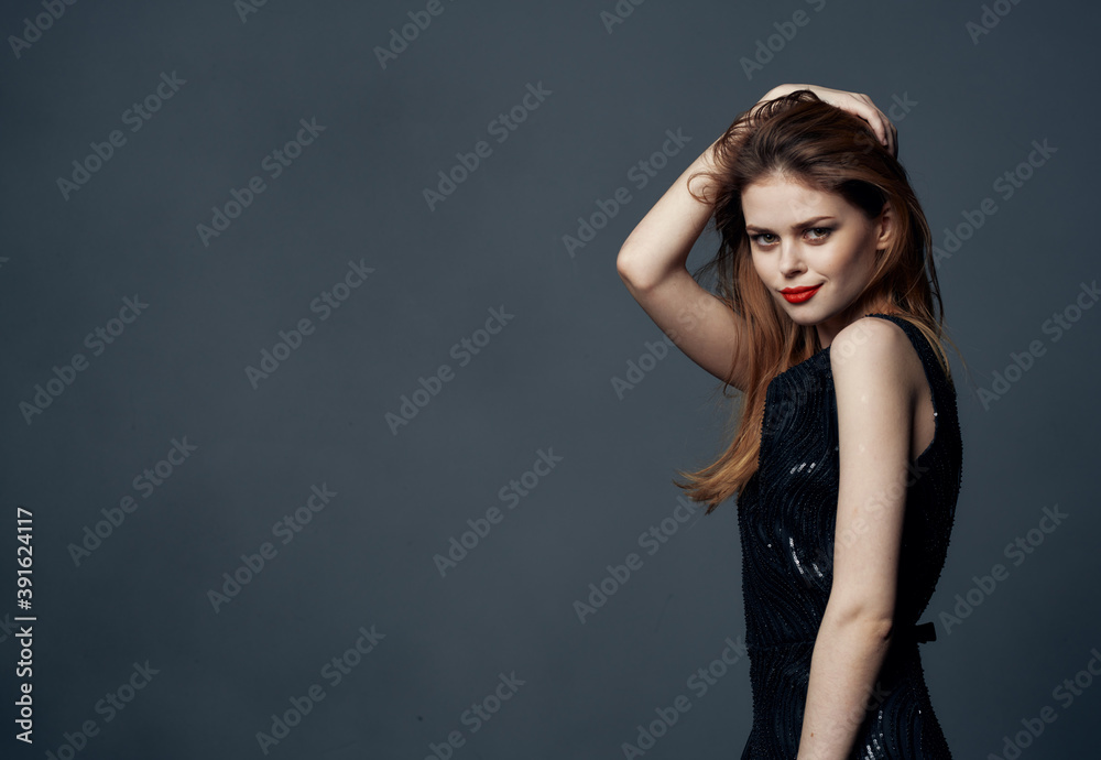 Woman on gray background in black dress cropped view Copy Space Woman on gray background in black dress cropped view Copy Space