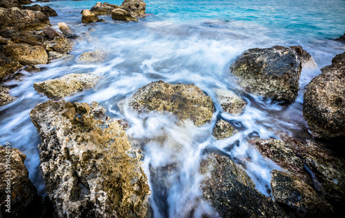 Beautiful water splasing on the stones in long exposure photo