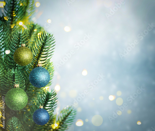 Christmas lights and pine branches and snow. Winter. Christmas. Blue festive winter background.
