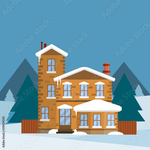 Winter home. Suburban building with snowdrifts on the natural landscape with forest and trees. Snowdrifts and icicles. A cozy home.