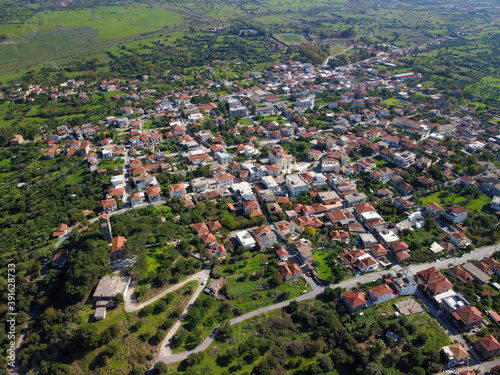 Aerial view of small village and crop fields at Autumn