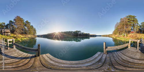 Fototapeta Naklejka Na Ścianę i Meble -  full seamless spherical hdri panorama 360 degrees angle view on wooden pier near lake in forest in evening in equirectangular projection with zenith, ready VR AR virtual reality content