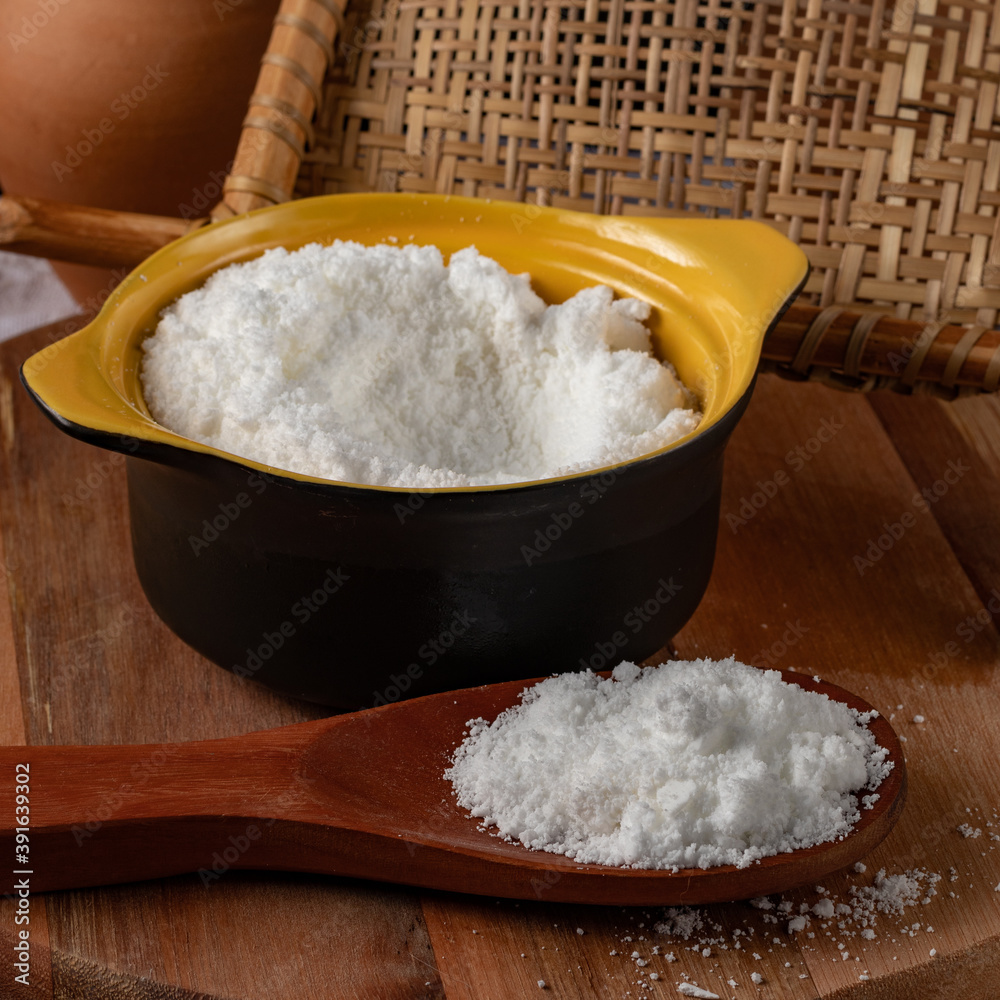 Tapioca flour (Farinha de tapioca). Flour made from cassava starch. Manioc. Typical Brazilian indigenous food. Perspective. Tapioca flour (Farinha de tapioca). Flour made from cassava starch. Manioc. Typical Brazilian indigenous food. Perspective.