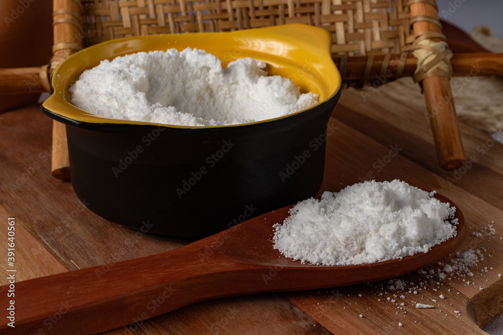 Tapioca flour (Farinha de tapioca). Flour made from cassava starch. Manioc. Typical Brazilian indigenous food. Perspective. Tapioca flour (Farinha de tapioca). Flour made from cassava starch. Manioc. Typical Brazilian indigenous food. Perspective.