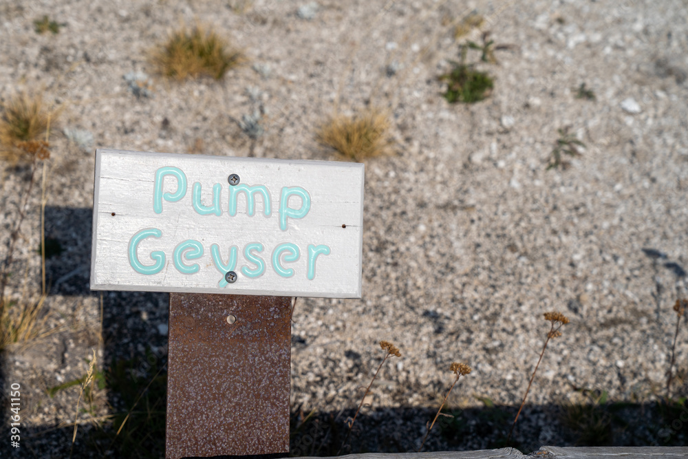 Pump Geyser sign, a hot spring thermal feature in the Upper Geyser Basin in Yellowstone National Park Pump Geyser sign, a hot spring thermal feature in the Upper Geyser Basin in Yellowstone National Park
