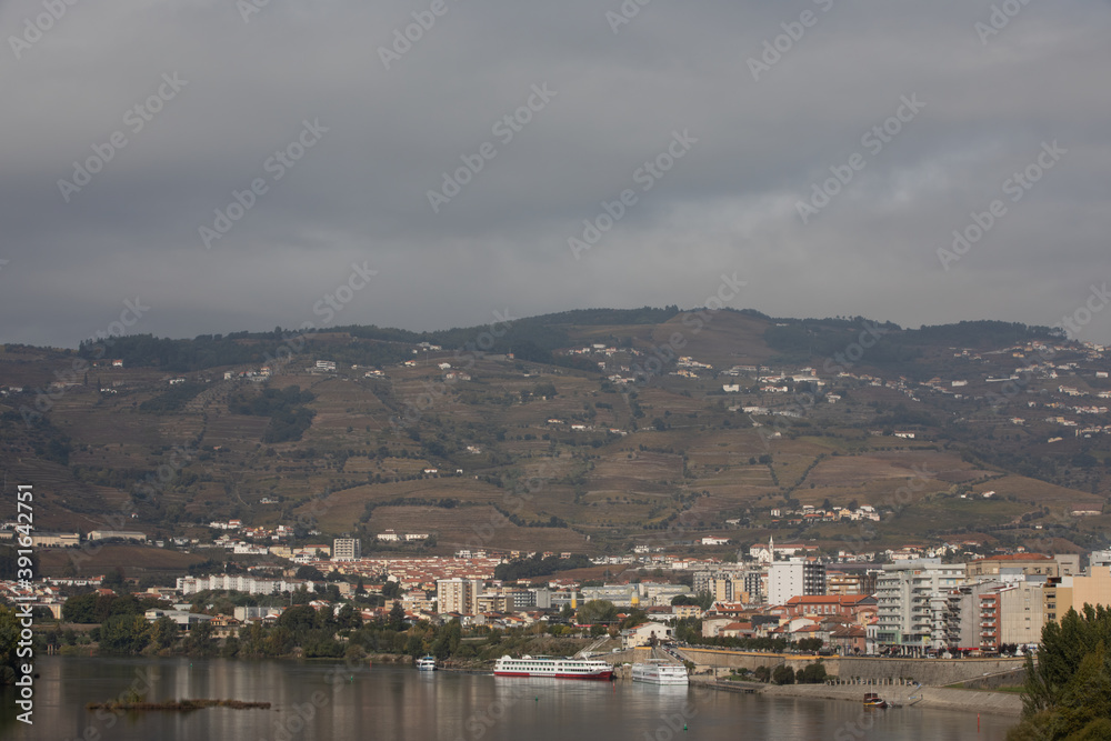 Pinhao, Portugal - October 17: View of Pinhão bridge, sitting on a bend of the Rio Douro, about 25km upriver from Peso da Régua in Portugal on October 17th, 2020 Pinhao, Portugal - October 17: View of Pinhão bridge, sitting on a bend of the Rio Douro, about 25km upriver from Peso da Régua in Portugal on October 17th, 2020