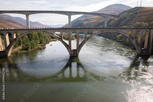 Pinhao, Portugal - October 17: View of Pinhão bridge, sitting on a bend of the Rio Douro, about 25km upriver from Peso da Régua in Portugal on October 17th, 2020 photo