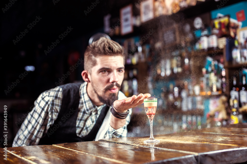 Barman creates a cocktail at the alehouse