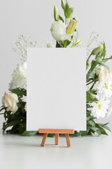 Wedding table number card mockup with a floral arrangement.