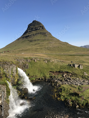 Vertical shot of the Kirkjufell Mountain in Grundarfjorour, Iceland photo