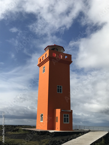 Vertical shot of the historic Svortuloft Lighthouse in the Western Region of Iceland photo