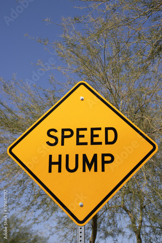 Photography Yellow Traffic sign speed bump against blue sky