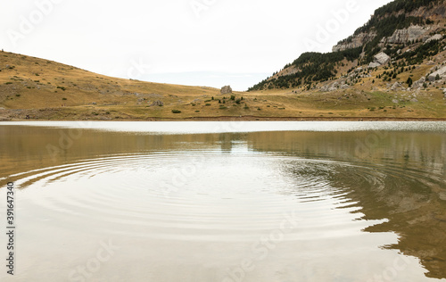 Water wave in lake in Pyrenees in Ibon of Piedrafita photo