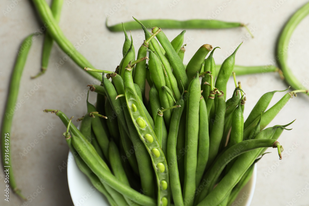 Fresh green beans on light grey table, flat lay Fresh green beans on light grey table, flat lay