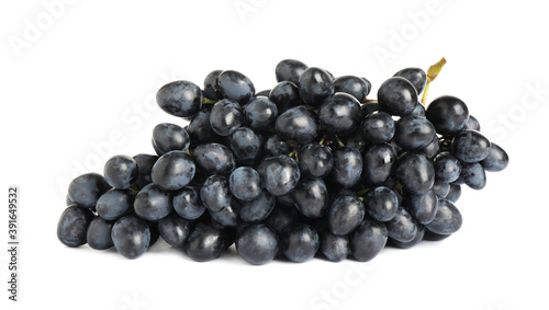 Bunch of fresh ripe juicy dark blue grapes isolated on white
