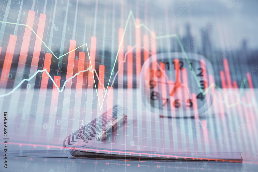 Multi exposure of financial graph drawings and desk with open notebook background. Concept of forex Multi exposure of financial graph drawings and desk with open notebook background. Concept of forex