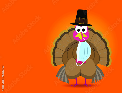 Funny thanksgiving turkey wearing a pilgrim hat with a surgical face mask hanging from his beak during the coronavirus pandemic