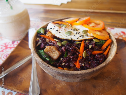 Healthy vegetable bowl with a fried egg on top, The food viewed from above, El Nido, Palawan, Philippines