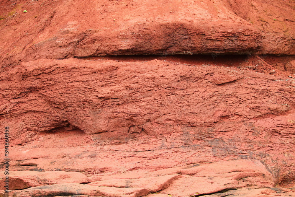 Fototapeta premium Red rock cliff face in Nova Scotia