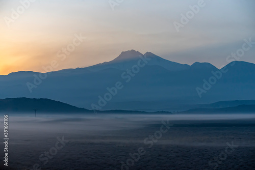 Sunrise with the mist over the river and the plain in Kayseri, in front of Erciyes mountain