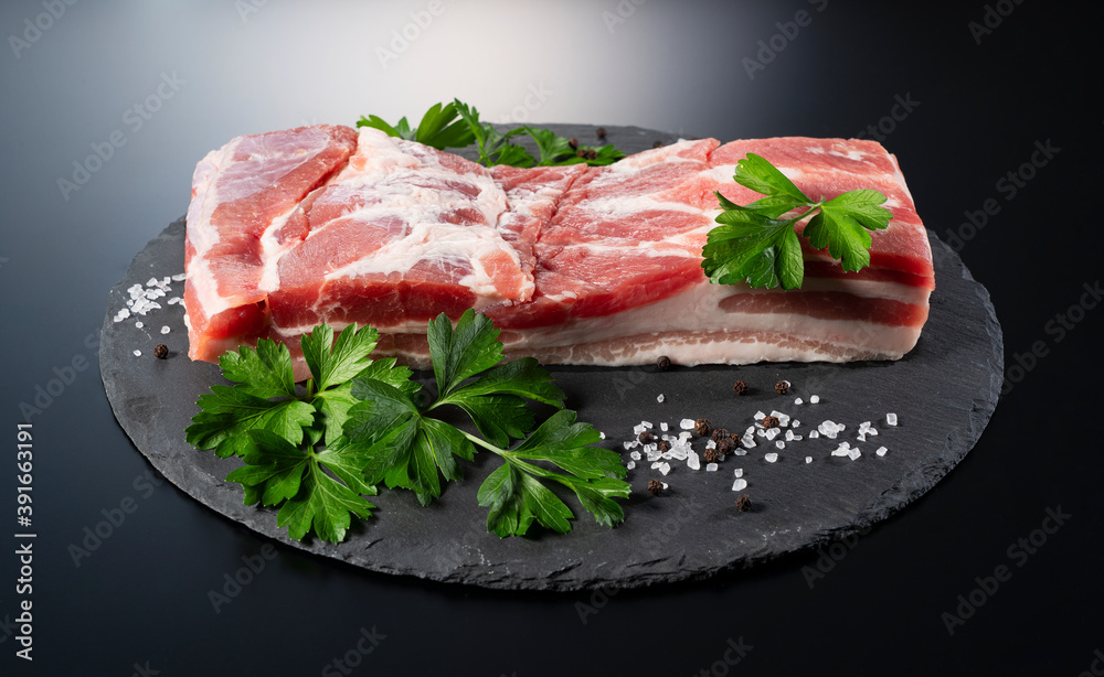 Pork belly on a black stone tray Pork belly on a black stone tray