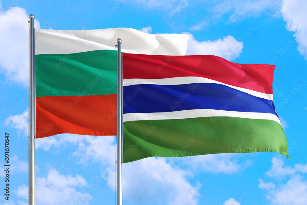 Gambia and Bulgaria national flag waving in the windy deep blue sky. Diplomacy and international relations concept. Gambia and Bulgaria national flag waving in the windy deep blue sky. Diplomacy and international relations concept.
