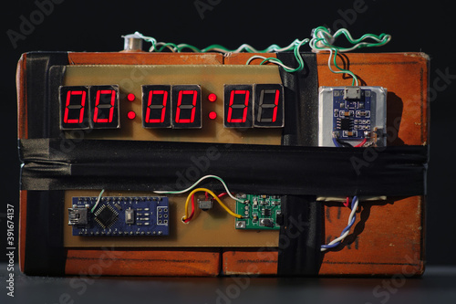 Fototapeta Bomb with red timer on black background