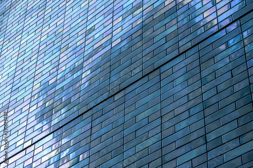 office building in the city. Abstract Detail Of Blue Vintage Tiled Wall, With Bright Sunlight, Backgrounds, Textures. Stock Photograph.