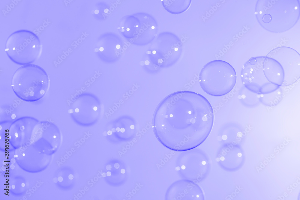 Beautiful shiny purple soap bubbles texture background. Abstract, Natural fresh soapy summer background.