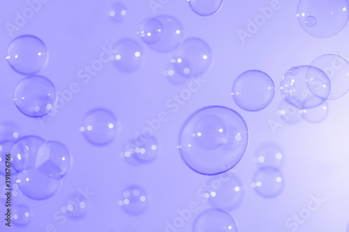 Beautiful shiny purple soap bubbles texture background. Abstract, Natural fresh soapy summer background.