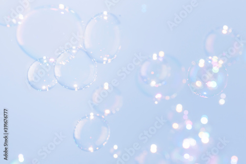 Beautiful shiny blue soap bubbles texture background. Abstract, Natural fresh soapy summer background.