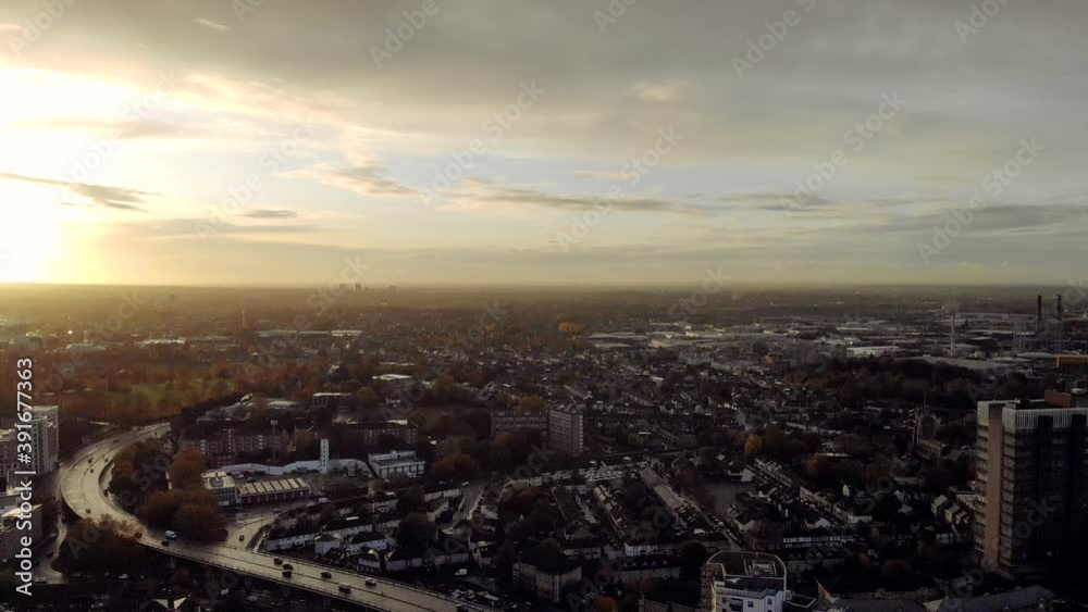 Croydon's streets in the sunset on a cloudy day, steady shot from a drone Croydon's streets in the sunset on a cloudy day, steady shot from a drone