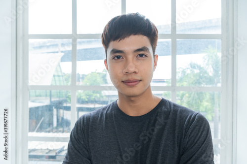 Portrait of Asian man in wearing casual t-shirt standing and looking at camera in studio. healthy lifestyle people concept. copy space Free Download Portrait of Asian man in wearing casual t-shirt standing and looking at camera in studio. healthy lifestyle people concept. copy space - GFXLoad