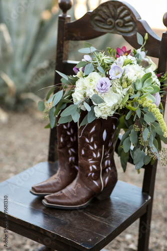 country western cowboy boots with a floral wedding bouquet