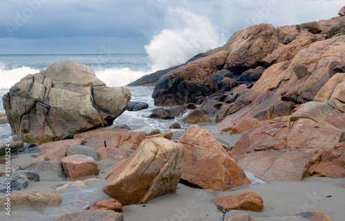Waves crash on rocks at Magnolia Beach, Manchester, Massachusetts.