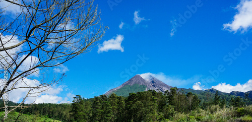 The beauty of Mount Merapi with blue sky photo