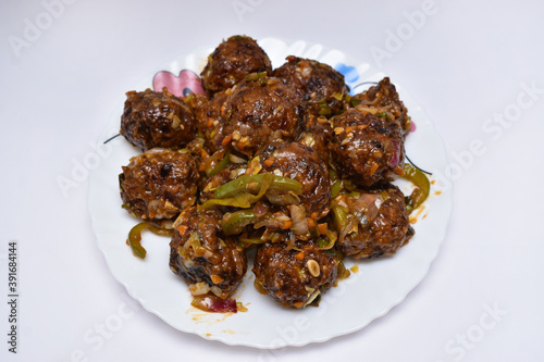 Gobi Manchurian dry - Popular street food of India made of cauliflower florets and other vegetables photo